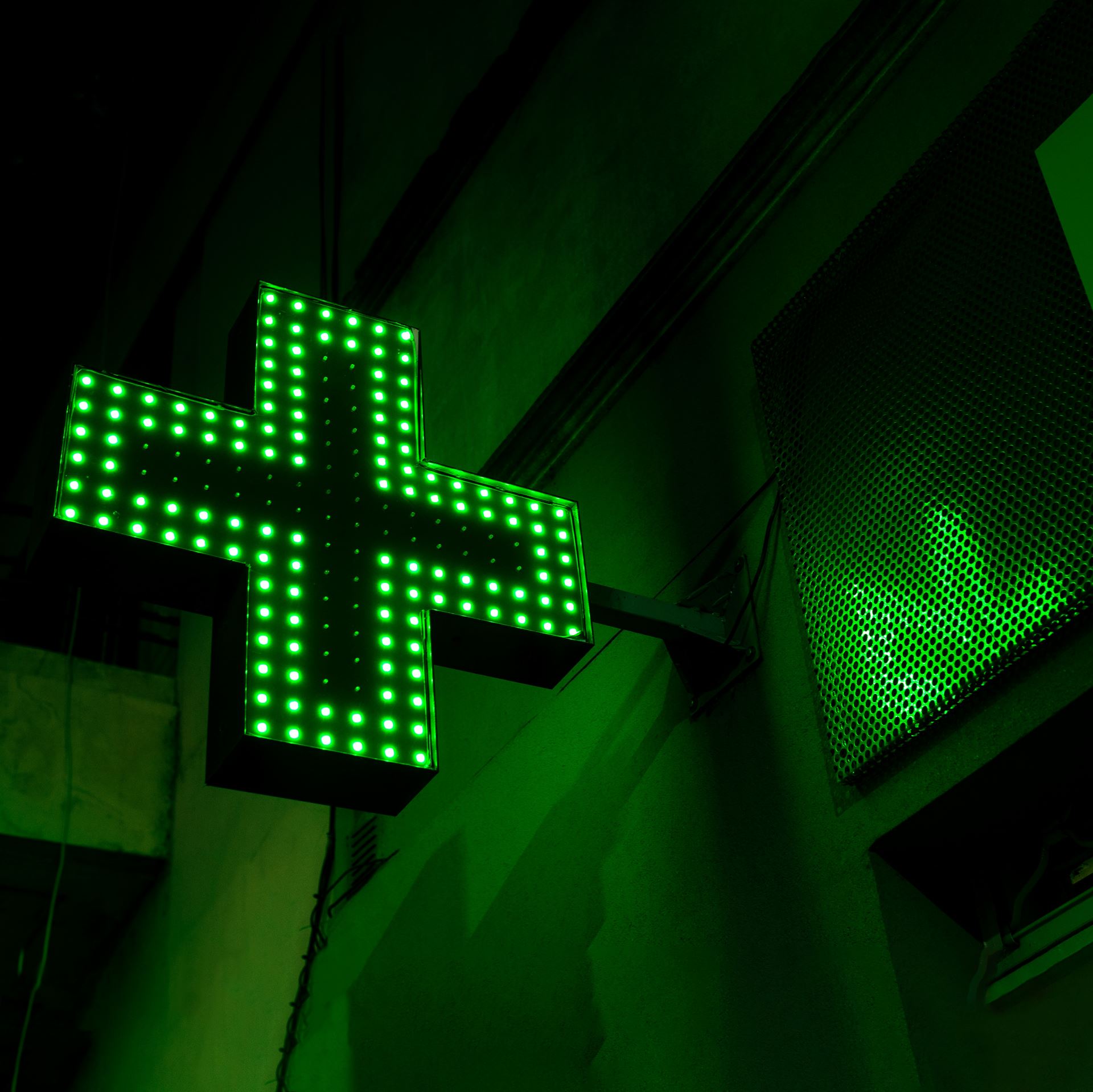 a neon pharmacy sign 